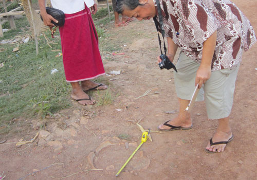 A researcher looks at a potential Martaban Jar in Mon State, Myanmar Times 20121126