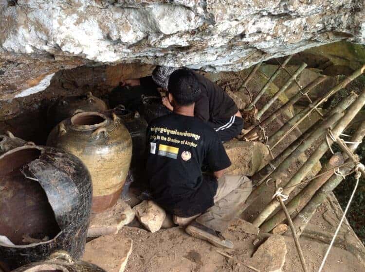 Chhueng Kan and Tep Sokha working on the jar burial ledge, Phnom Khnang Peurng. Source: The Royal Society of New Zealand 20150911