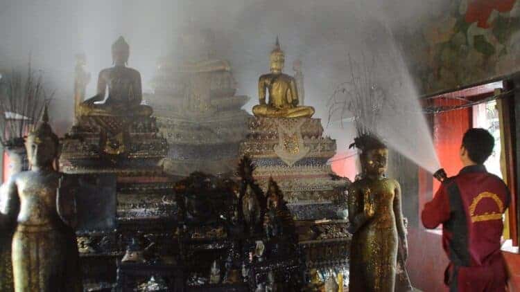 Ayutthaya temple fire damages ancient Buddha statue