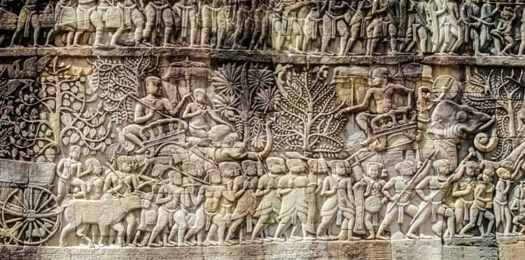 Bas relief sculpture, elephant charging into battle and the battle between the Cham and Khmer. The battles conducted by Jayavarman VII against the invading Cham. Bayon Temple, Angkor Thom, Seam Reap. Source: Jak149 / Shutterstock