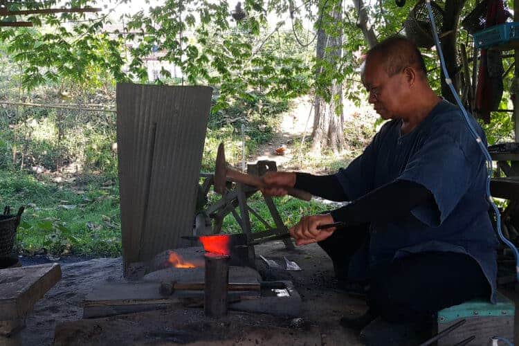 Tai Phuan man smithing a knife in Nan province. Source: Bangkok Post 20191130